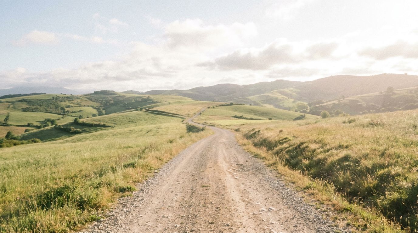 An illustration of a winding country path through green hills in soft sunlight.